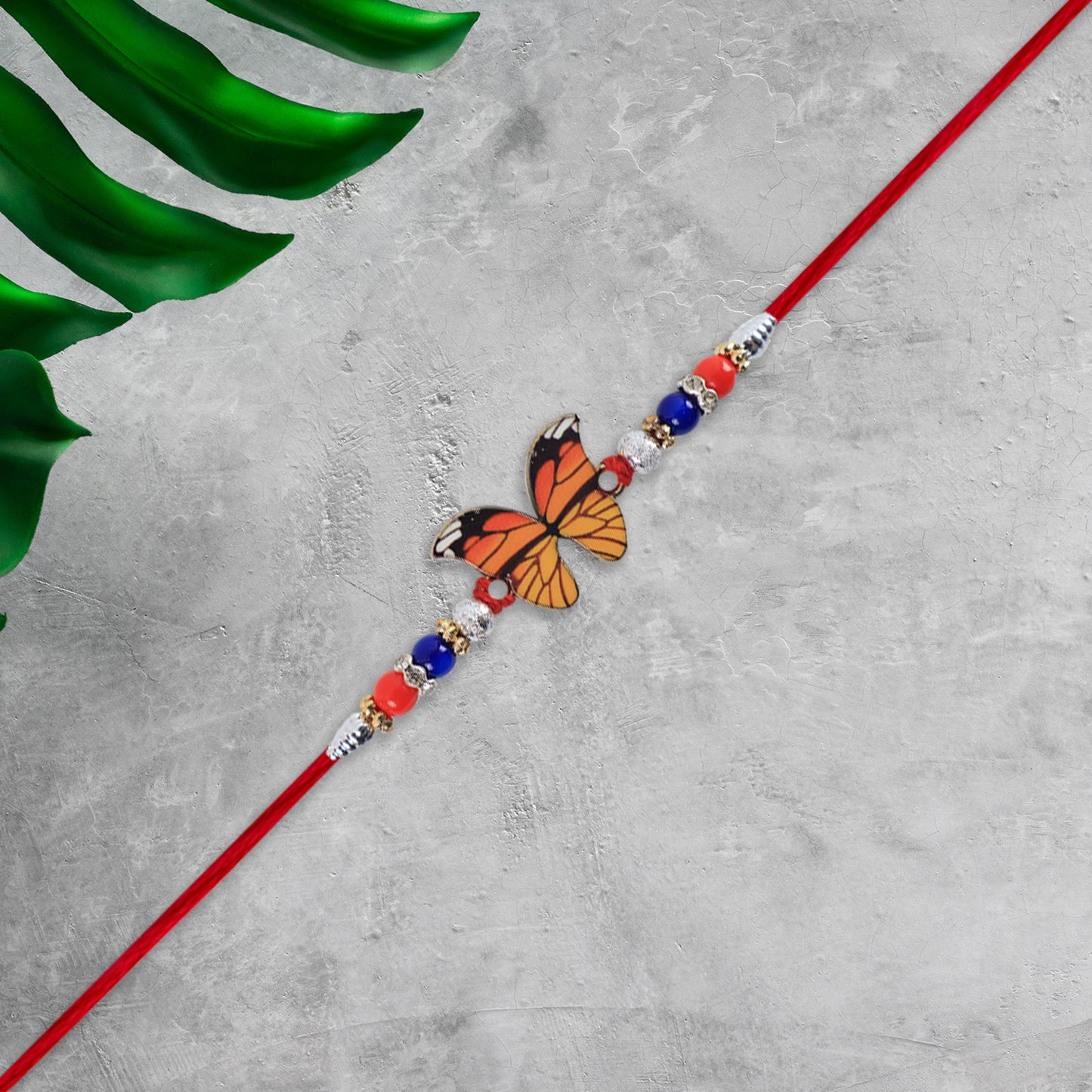 Vibrant Butterfly Rakhi With Colorful Beads Red Mauli Thread