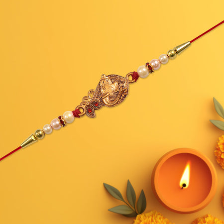Graceful Golden Peacock Rakhi With Pearl Beads And Red Thread Traditional Raksha Bandhan Bracelet For Brother