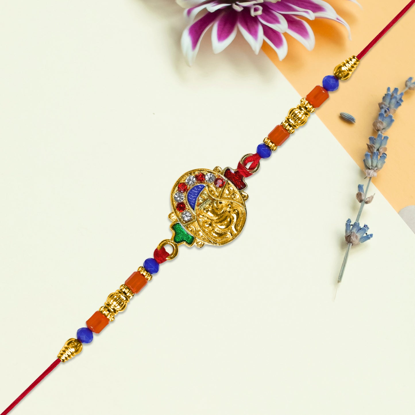 Ganesh Face Rakhi With Colorful Beads And Stones