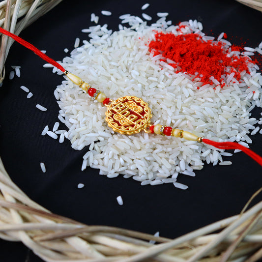Golden Swastik Rakhi With Red Beads And Thread