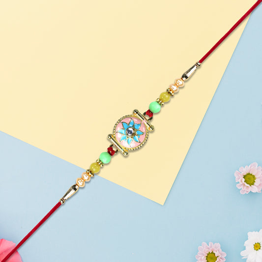 Designer Rakhi With Blue-pink Flower And Decorative Beads